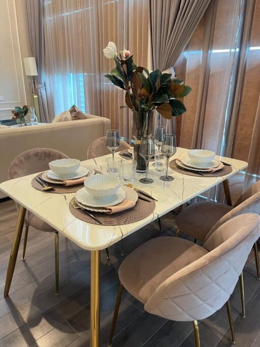 Elegant dining area with marble table and cushioned chairs