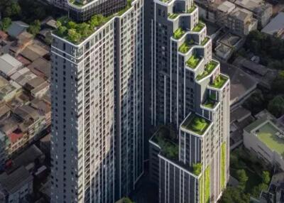 High-rise residential building with rooftop gardens