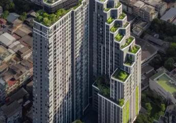 High-rise residential building with rooftop gardens