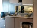 Modern compact kitchen with appliances