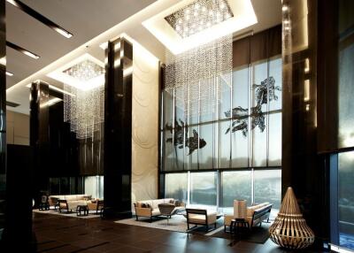 Modern luxurious lobby with high ceilings and large windows