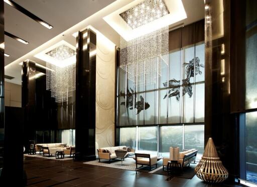 Modern luxurious lobby with high ceilings and large windows