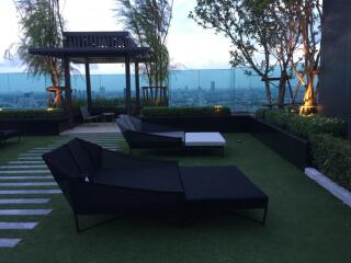 Rooftop garden with lounge seating and city view