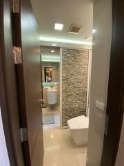 Modern bathroom with stone accent wall