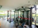 Fully equipped gym with modern equipment and natural light