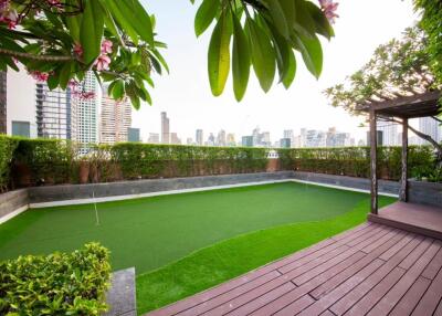 Rooftop garden with putting green and city view