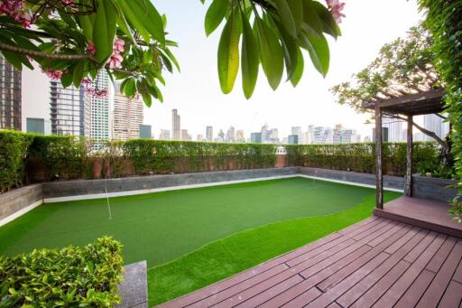 Rooftop garden with putting green and city view