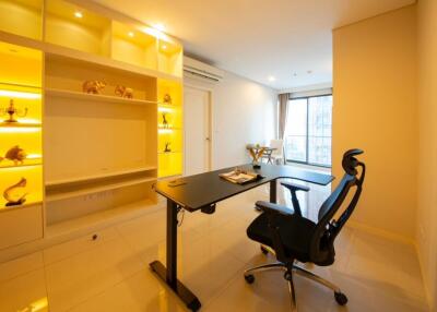 Bright and modern study room with desk and built-in shelves