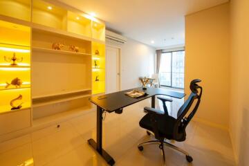 Bright and modern study room with desk and built-in shelves