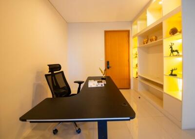 Modern home office with desk and bright shelving