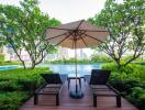 Swimming pool with deck chairs and umbrella