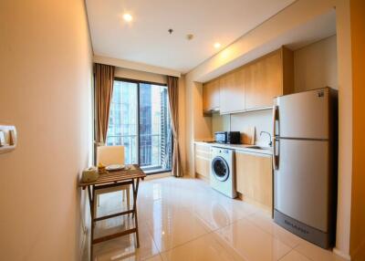 Modern kitchen with dining area and laundry integrated