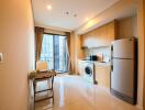 Modern kitchen with dining area and laundry integrated