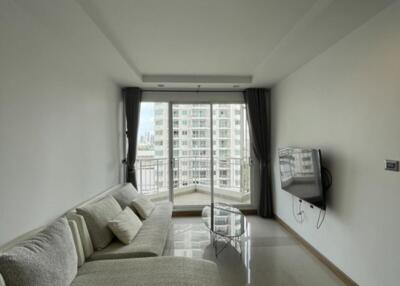 Modern living room with balcony and city view