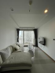 Modern living room with balcony and city view