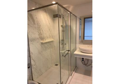 Modern bathroom with glass shower enclosure