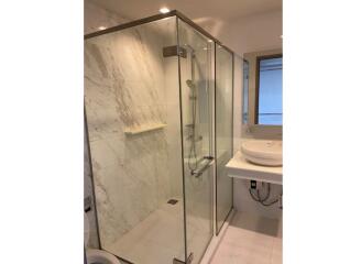 Modern bathroom with glass shower enclosure