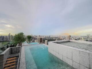 Rooftop pool with a view of the city skyline