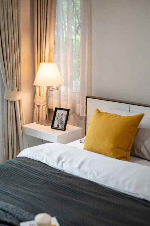 Cozy bedroom with bedside table and lamp