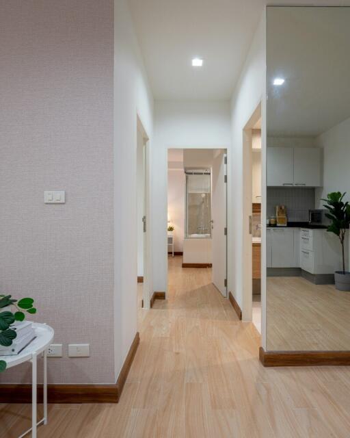 Hallway leading to bathroom and kitchen