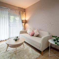 Cozy living room with a sofa, coffee table, and large window