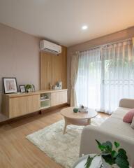 A cozy living room with modern furniture and natural light.