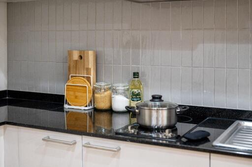 Modern kitchen countertop with cooking essentials and stove