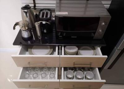 Kitchen countertop with appliances and open drawers