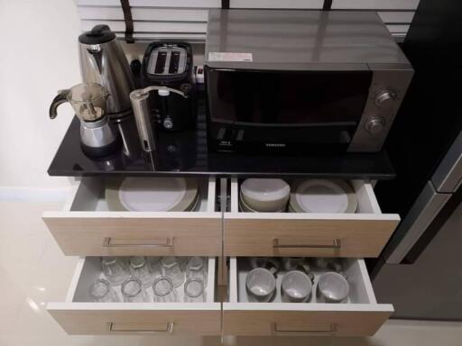 Kitchen countertop with appliances and open drawers