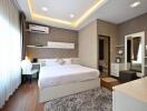 Modern bedroom with large bed, ambient lighting, and stylish decor