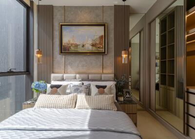 Modern bedroom with large window, artwork, and built-in wardrobe