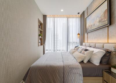 Bedroom with modern decor and large window