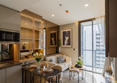 Modern living room with kitchen area and city view