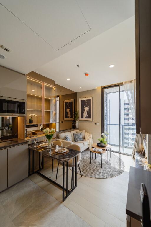 Modern living room with kitchen area and city view