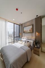 Modern bedroom with a view of the city