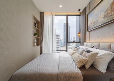 modern bedroom with large window offering city view