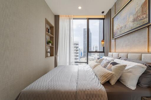 modern bedroom with large window offering city view