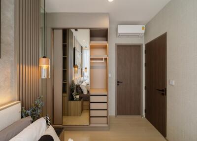 Stylish bedroom with a wardrobe, door, and AC unit