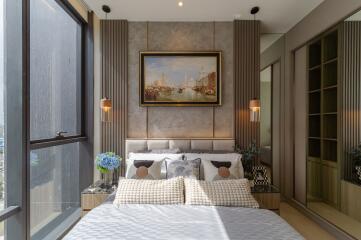 Modern bedroom with large window and elegant decor