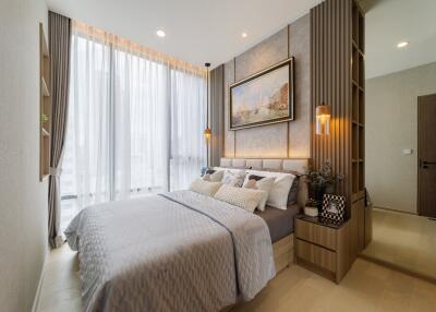 Modern styled bedroom with large windows and elegant furnishings