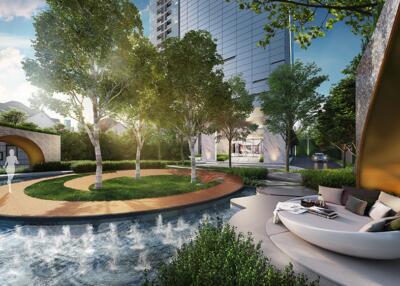 Outdoor garden area with water feature and seating