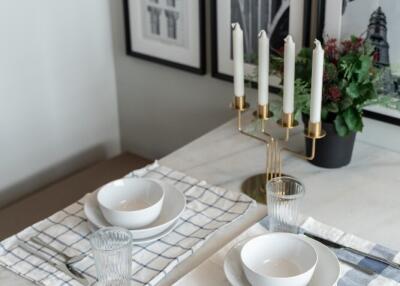 Dining area with table setting and wall art