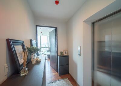 Entrance hallway with elevator and view into living area