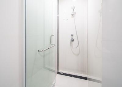 Modern bathroom with walk-in shower and glass door