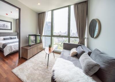 Modern living room with large windows and city view