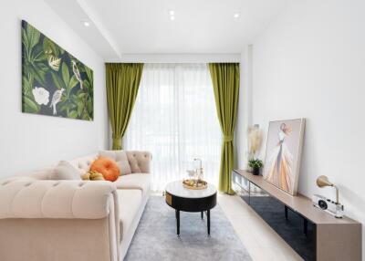 Contemporary living room with a beige sofa, green curtains, and decorated with modern art pieces.