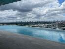 rooftop swimming pool with a skyline view