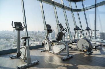 Modern fitness center with city views