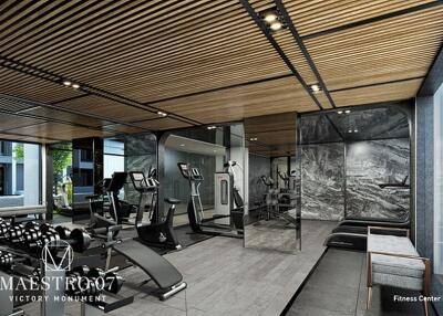 Modern fitness center with exercise equipment and mirrors