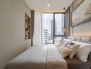 Modern and cozy bedroom with large windows and wall art